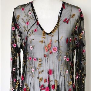 Embroidered black net dress